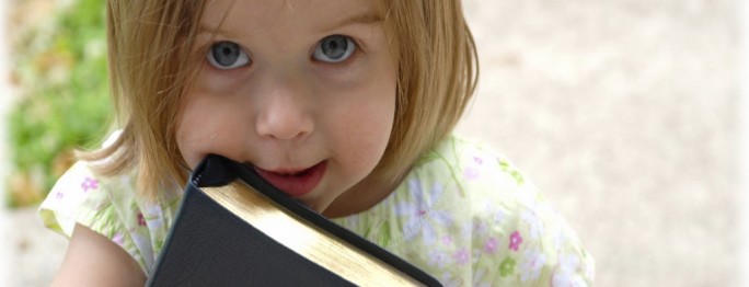 This little one picked up her dad's Bible on the way out of church.